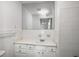 Bright bathroom features white tile and vanity with storage at 1101 Collier Nw Rd # L3, Atlanta, GA 30318