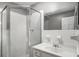 Clean bathroom featuring a glass shower stall and a vanity with modern fixtures at 1101 Collier Nw Rd # L3, Atlanta, GA 30318