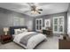 Spacious bedroom with a ceiling fan, desk, and a queen bed at 1101 Collier Nw Rd # L3, Atlanta, GA 30318