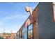 Exterior of a building with a painted mural, signage, and an interesting mix of brick and design elements at 1101 Collier Nw Rd # L3, Atlanta, GA 30318