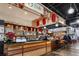 Well-lit restaurant counter area with wood details, lantern decor and a TV menu board at 1101 Collier Nw Rd # L3, Atlanta, GA 30318