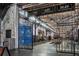 Well-lit, open hall with decorative metalwork, a high ceiling, and a polished concrete floor at 1101 Collier Nw Rd # L3, Atlanta, GA 30318