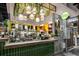 Restaurant counter view with wood and tile accents, plants and a drop-down lighting fixture at 1101 Collier Nw Rd # L3, Atlanta, GA 30318