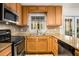 Close-up of a kitchen with stainless steel appliances, ample cabinetry and granite countertops at 1101 Collier Nw Rd # L3, Atlanta, GA 30318