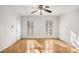 Bright room with hardwood floors, white trim, and shuttered windows at 1101 Collier Nw Rd # L3, Atlanta, GA 30318