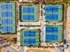 Aerial view of tennis courts with bright blue surfaces, and green perimeters at 1101 Collier Nw Rd # L3, Atlanta, GA 30318