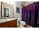 Bathroom with granite countertop, shower, and toilet at 1939 Ridgemont Ln, Decatur, GA 30033