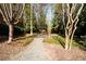 A gravel pathway winds through a wooded area with benches at 1939 Ridgemont Ln, Decatur, GA 30033