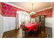 Formal dining room with dark hardwood floors and red accents at 1939 Ridgemont Ln, Decatur, GA 30033