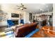 Open concept living room with hardwood floors, built-in shelving, and fireplace at 1939 Ridgemont Ln, Decatur, GA 30033