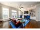 Bright living room with hardwood floors, fireplace, and a leather couch at 1939 Ridgemont Ln, Decatur, GA 30033