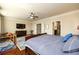 Main bedroom with hardwood floors, large windows, and a sitting area at 1939 Ridgemont Ln, Decatur, GA 30033