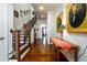 Elegant staircase with dark wood railings and hardwood floors at 1939 Ridgemont Ln, Decatur, GA 30033