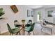 Small dining area with glass table and green velvet chairs at 2278 Jamin Bnd # 17, Lithonia, GA 30058