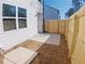 View of the backyard featuring a wooden fence, concrete patio and a grassy area, perfect for relaxation at 2280 Jamin Bnd # 17, Lithonia, GA 30058