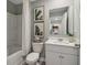 A well-lit bathroom showcases a shower-tub combination and a modern vanity with neutral wall art at 2280 Jamin Bnd # 17, Lithonia, GA 30058