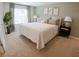 Serene bedroom with neutral tones, plush carpeting, and large window at 2280 Jamin Bnd # 17, Lithonia, GA 30058