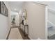 Inviting hallway with wood floors, neutral walls, decorative mirror, and stairway access at 2280 Jamin Bnd # 17, Lithonia, GA 30058