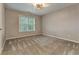 Well-lit bedroom with neutral walls and carpet flooring at 5032 Hickory Hills Dr, Woodstock, GA 30188