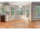 Bright dining area with hardwood floors and chandelier at 5032 Hickory Hills Dr, Woodstock, GA 30188