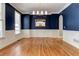 Formal dining room features hardwood floors and stylish chandelier at 5032 Hickory Hills Dr, Woodstock, GA 30188