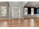 Hardwood floors and two-story entry with an open staircase at 5032 Hickory Hills Dr, Woodstock, GA 30188