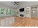 Bright Gathering room with hardwood floors, fireplace and high ceilings at 5032 Hickory Hills Dr, Woodstock, GA 30188