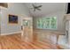 Gathering room with hardwood floors, vaulted ceiling, and wall of windows at 5032 Hickory Hills Dr, Woodstock, GA 30188