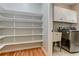 Large pantry with shelving and laundry hookups at 5032 Hickory Hills Dr, Woodstock, GA 30188