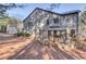 View of the home's deck and backyard, featuring a shaded gazebo with comfortable seating at 588 Myrtle Trace Ln, Suwanee, GA 30024