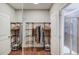 Walk-in closet with ample shelving and hanging space at 588 Myrtle Trace Ln, Suwanee, GA 30024