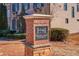 Stone pillar with the Highland Station community sign, surrounded by manicured landscaping at 588 Myrtle Trace Ln, Suwanee, GA 30024