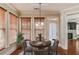 Charming dining area with a round table, stylish chairs, and natural light from the large window at 588 Myrtle Trace Ln, Suwanee, GA 30024