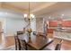 Open concept dining room with kitchen views at 588 Myrtle Trace Ln, Suwanee, GA 30024