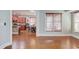 Spacious room showcasing the kitchen, featuring wood floors and natural light at 588 Myrtle Trace Ln, Suwanee, GA 30024