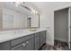 Bathroom with gray vanity and a large mirror at 969 Rittenhouse Way, Atlanta, GA 30316