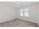 Simple bedroom with neutral walls and carpet at 969 Rittenhouse Way, Atlanta, GA 30316