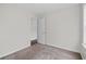 Well-lit bedroom with carpet and access to another room at 969 Rittenhouse Way, Atlanta, GA 30316