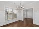 Bright dining room features hardwood floors, chandelier, and view of backyard at 969 Rittenhouse Way, Atlanta, GA 30316