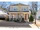 Two-story house with gray siding, brick accents, and a front porch at 969 Rittenhouse Way, Atlanta, GA 30316