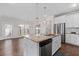 Modern kitchen with white cabinets, granite island, and stainless steel appliances at 969 Rittenhouse Way, Atlanta, GA 30316