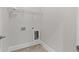 Convenient laundry room with shelving and tile flooring at 969 Rittenhouse Way, Atlanta, GA 30316