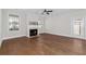 Living room with hardwood floors, fireplace and a ceiling fan at 969 Rittenhouse Way, Atlanta, GA 30316