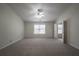 Large bedroom with window and carpet flooring at 1249 Simonton Glen Way, Lawrenceville, GA 30045