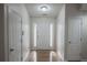 Bright and airy entryway with hardwood floors and neutral walls at 1249 Simonton Glen Way, Lawrenceville, GA 30045