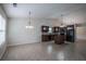 Open concept kitchen with island and dark wood cabinets at 1249 Simonton Glen Way, Lawrenceville, GA 30045