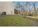 Backyard view showing deck, patio doors, and wooded area at 1362 Meadow Creek Nw Way, Acworth, GA 30102