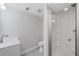 Basement bathroom with a walk-in shower and white vanity at 1362 Meadow Creek Nw Way, Acworth, GA 30102