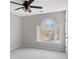 Well-lit bedroom featuring an arched window and ceiling fan at 1362 Meadow Creek Nw Way, Acworth, GA 30102