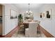 Elegant dining room with hardwood floors and wainscoting details at 1362 Meadow Creek Nw Way, Acworth, GA 30102